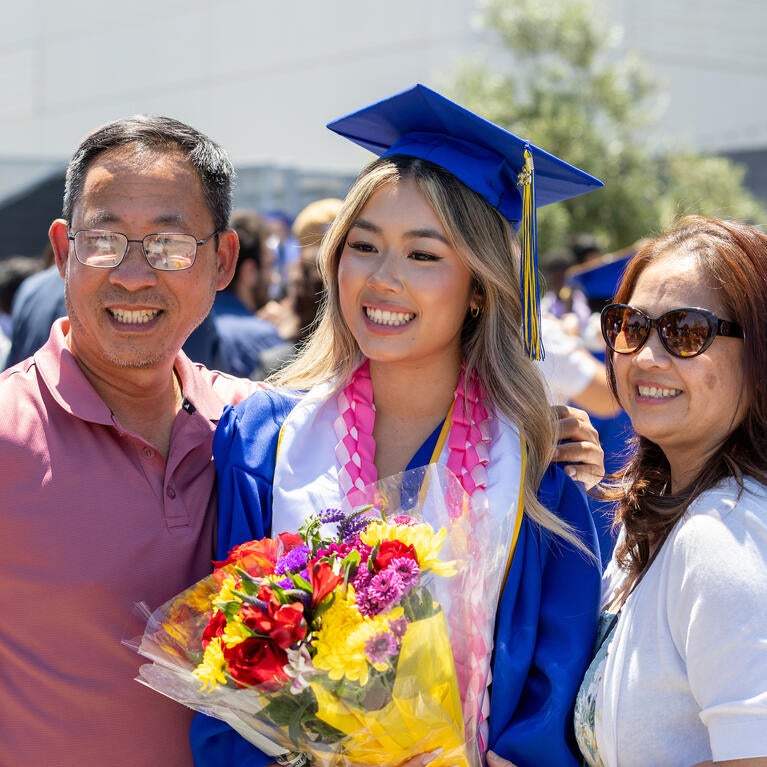 Class of 2026 graduate with family